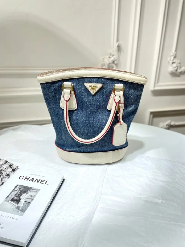 Prada Cahier bags featuring the signature triangular logo plaquePrada Vintage Denim Blue Bucket Bag Large