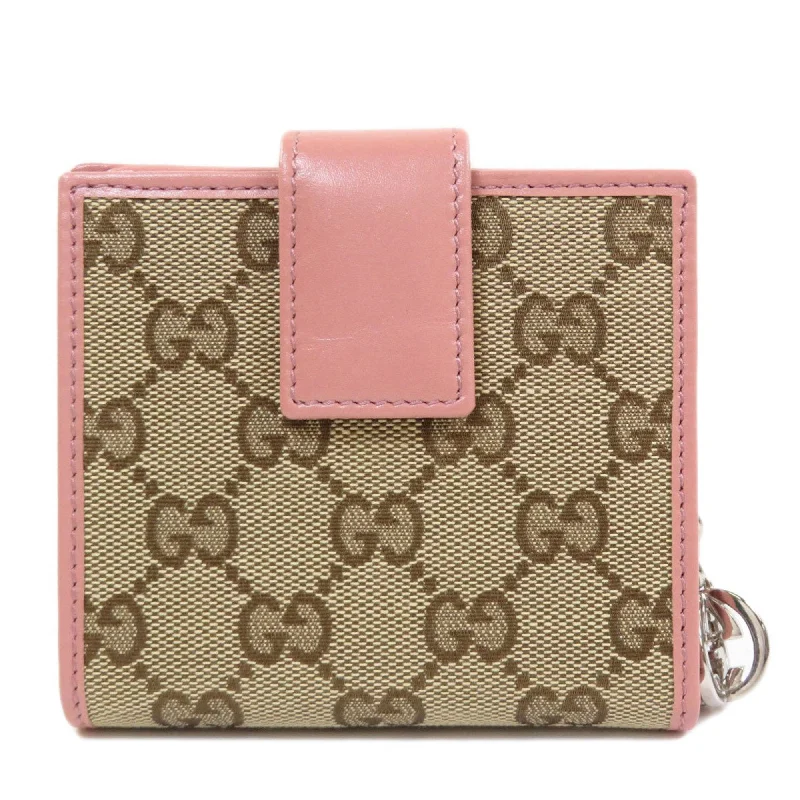 Women Gucci bags with interlocking G hardware for a classic lookWomen Gucci bags with interlocking G hardware for a classic lookGucci 233021 GG bi-fold wallet canvas ladies