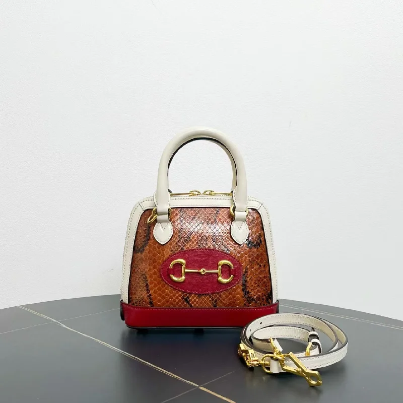 Women Gucci crossbody bags in a bold red colorWomen Gucci crossbody bags in a bold red colorGucci 1955 Horsebit Snakeskin Small Top Handle Bag Multicolor