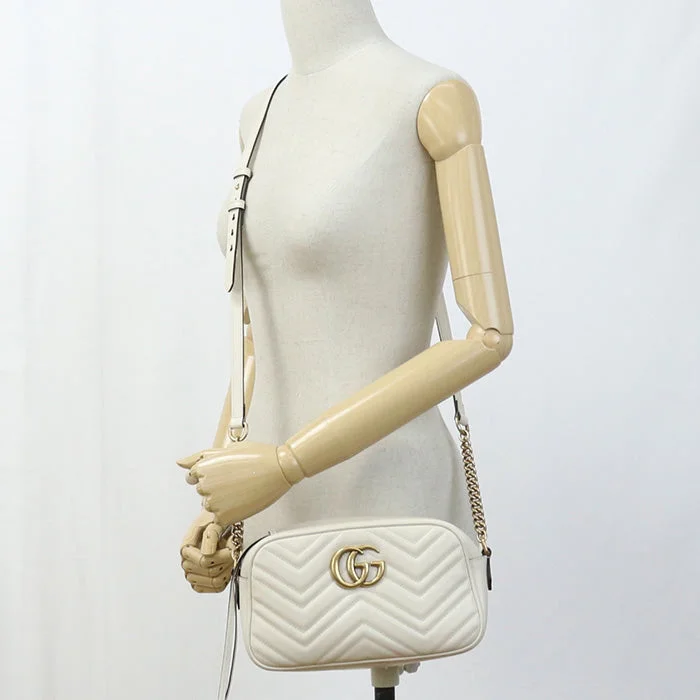 Ladies Gucci shoulder bags with a tassel decorationLadies Gucci shoulder bags with a tassel decorationGUCCI 447632 Small Shoulder Bag GG Marmont Diagonal sling leather white Women