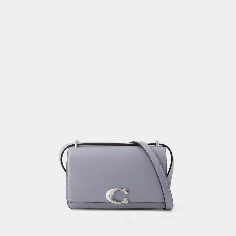 Coach tote bags with a snap - button closure and a decorative charm for styleBandit Crossbody  - Coach - Leather - Grey Blue