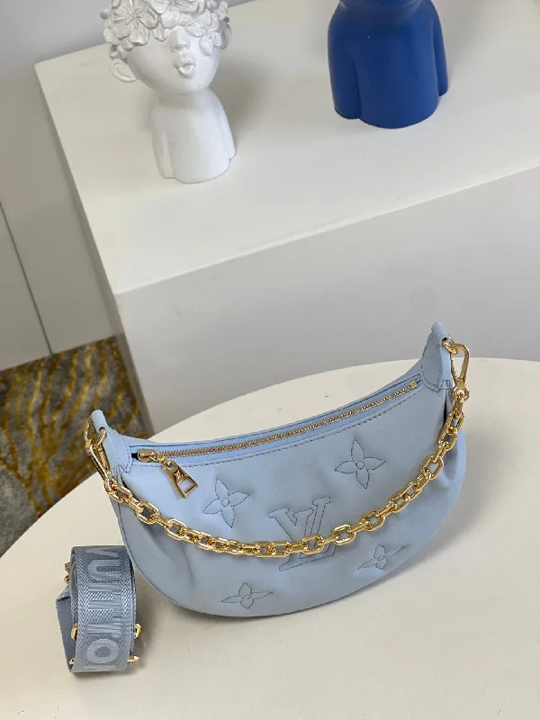 Ladies Louis Vuitton Petite Malle bags in a pastel color for a soft lookLouis Vuitton Over The Moon Bag