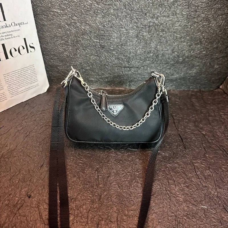 Prada Cleo bags with a snakeskin - effect panel for a bold and trendy lookPrada Black Nylon Leather Mini Handbag Crossbody Bag