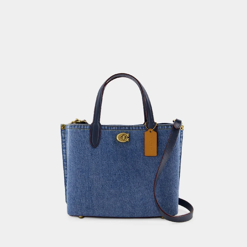 Coach Dempsey bags with a contrast - colored interior for visual interestWillow 24 Shopper Bag - Coach - Canvas - Blue