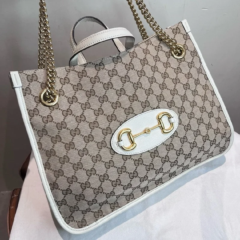 Women Gucci Sylvie bags featuring the signature web stripeWomen Gucci Sylvie bags featuring the signature web stripeGucci 1955 Beige White Monogram Large Tote Bag