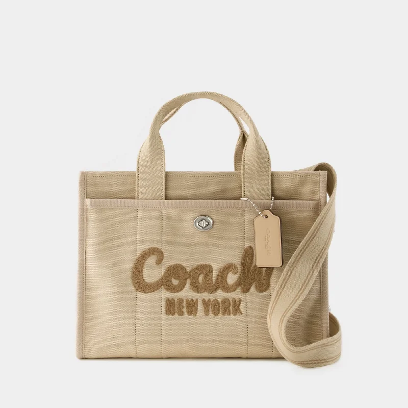 Coach bags with a front - zip pocket for small items like keys and cardsCargo Tote  - Coach - Canvas - White