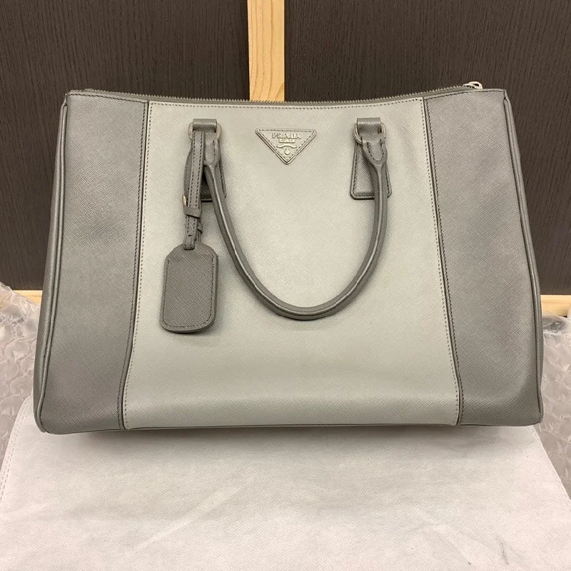 Prada Cahier bags with a monogram - embossed leather surfacePrada Grey Leather Tote Bag Large