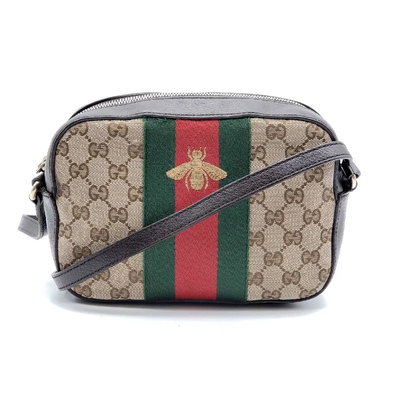 Women Gucci bags with a chain - link trim and a leather bodyWomen Gucci bags with a chain - link trim and a leather bodyGucci Bee Soho Camera Crossbody Bag