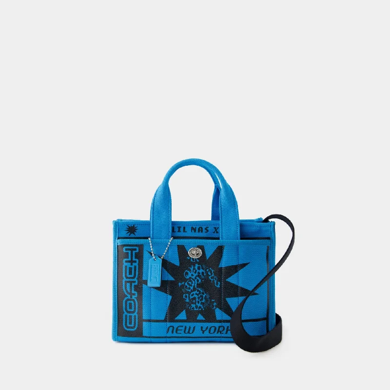 Coach Borough bags with a structured silhouette and a magnetic - snap closureLil Nas X Drop Cargo Tote 26 - Coach - Canvas - Blue