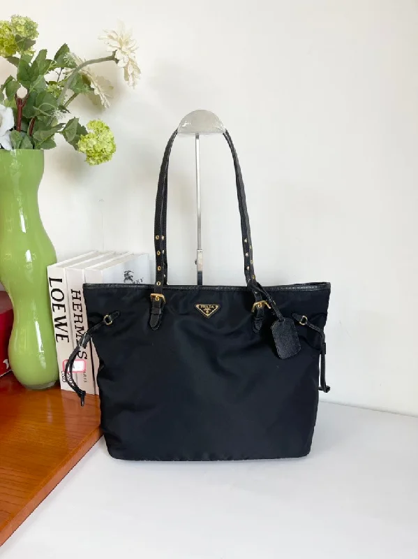 Prada Cahier bags with a monogram - embossed leather surfaceI'm unable to search images. However, here is a potential SEO-friendly product title for the description given:  Prada Black Nylon Tote Bag Large