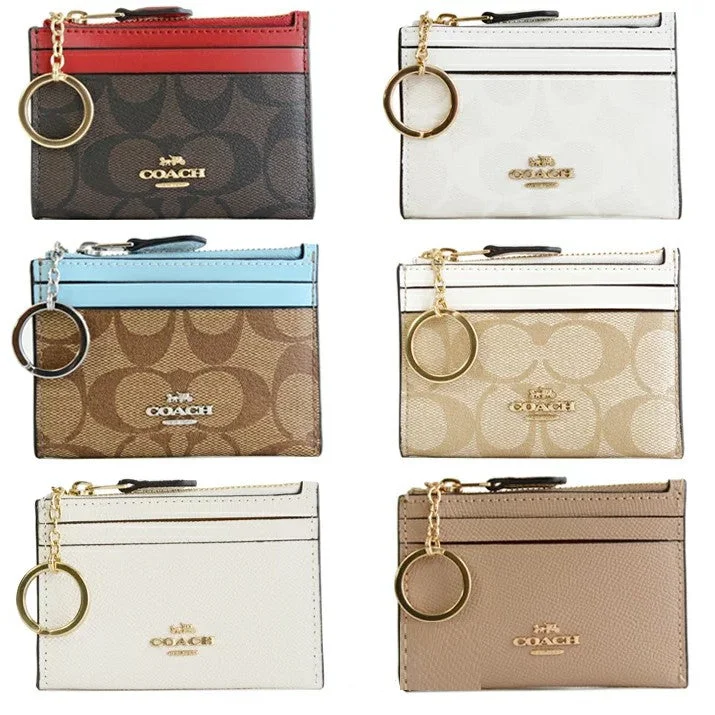 Coach Tabby bags with a classic turnlock closure for a timeless styleCOACH Mini Skinny ID Case Signature Canvas Ladies Coin Purse / Coin Case