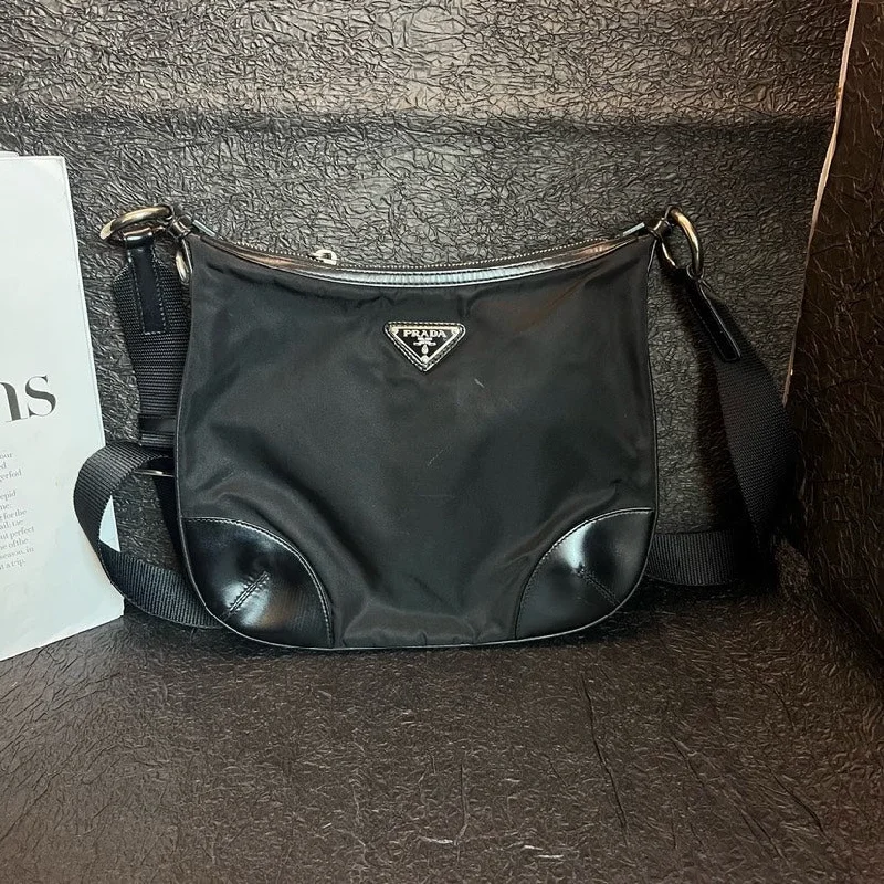 Ladies Prada handbags with a detachable wallet inside for added conveniencePrada Black Nylon Parachute Crossbody Bag 27cm