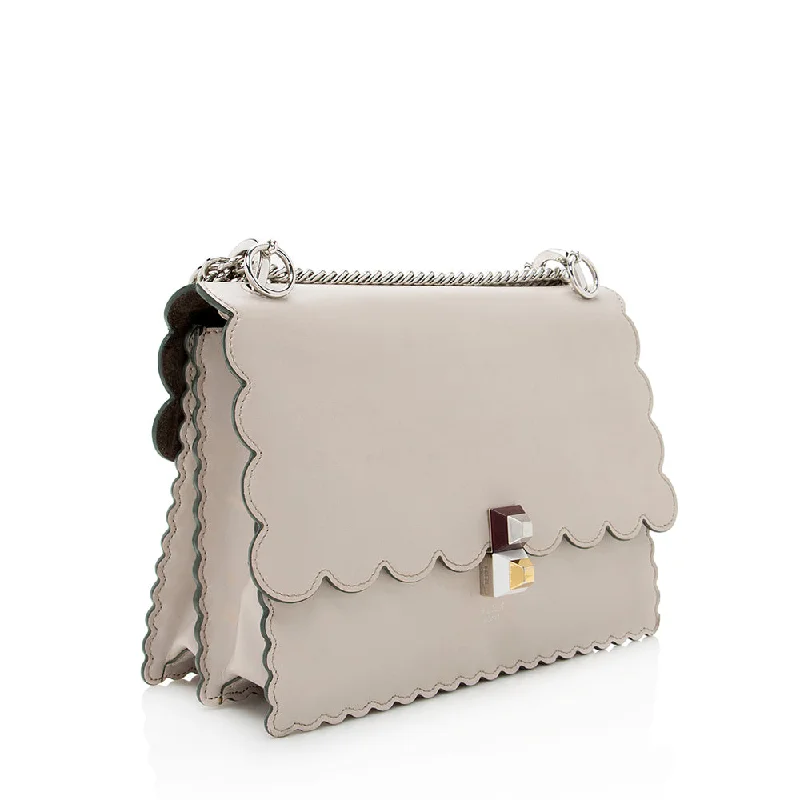 Fendi crossbody bags with a faux fur trim for a warm and stylish winter accessoryFendi Calfskin Studded Kan I Medium Shoulder Bag (SHF-19206)