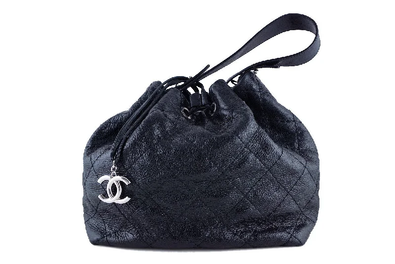 Chanel bags with exclusive seasonal designs and materialsChanel Black On the Road Large Drawstring Bucket Tote Bag